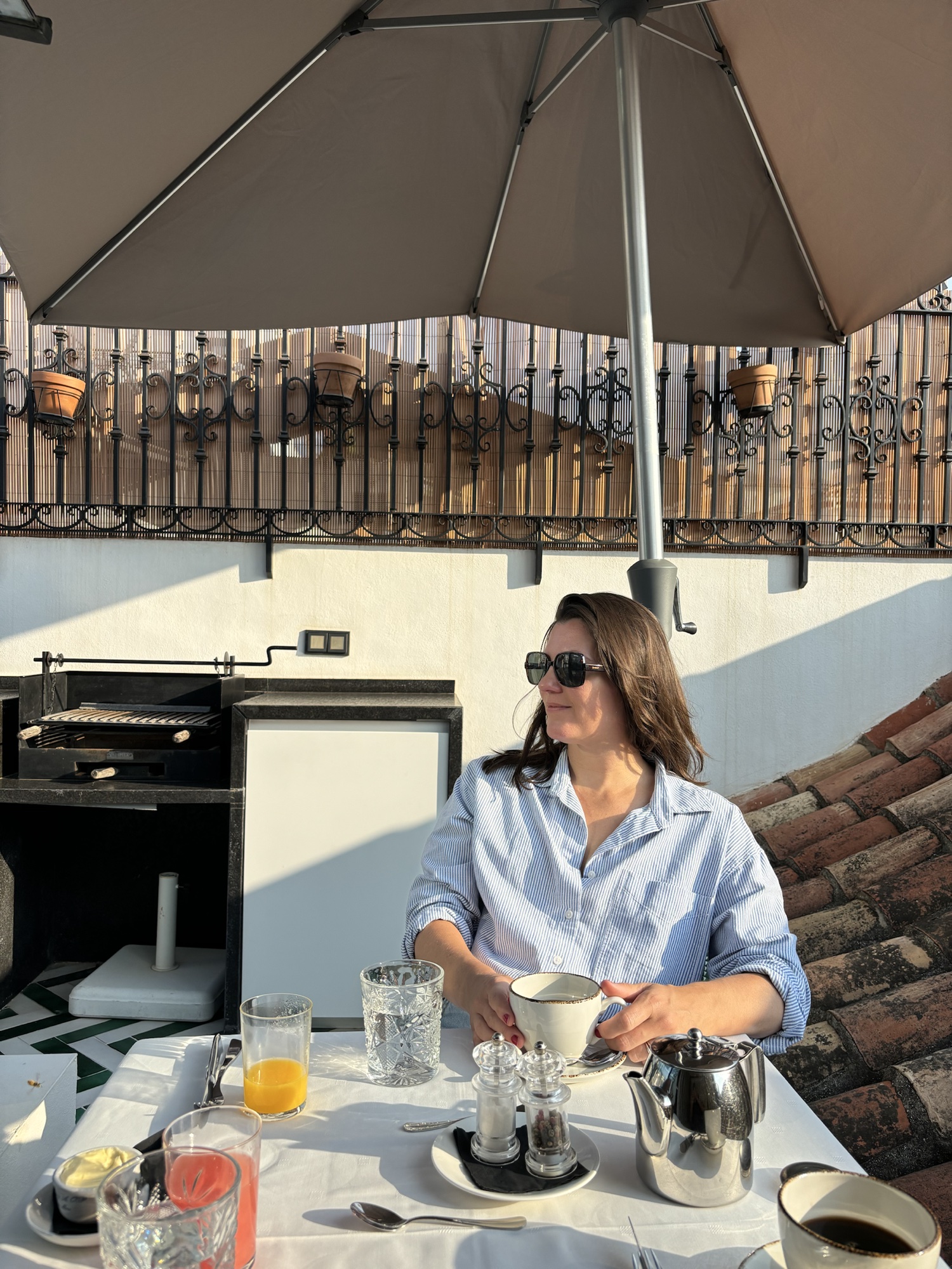 Carly enjoying breakfast outdoors in Spain