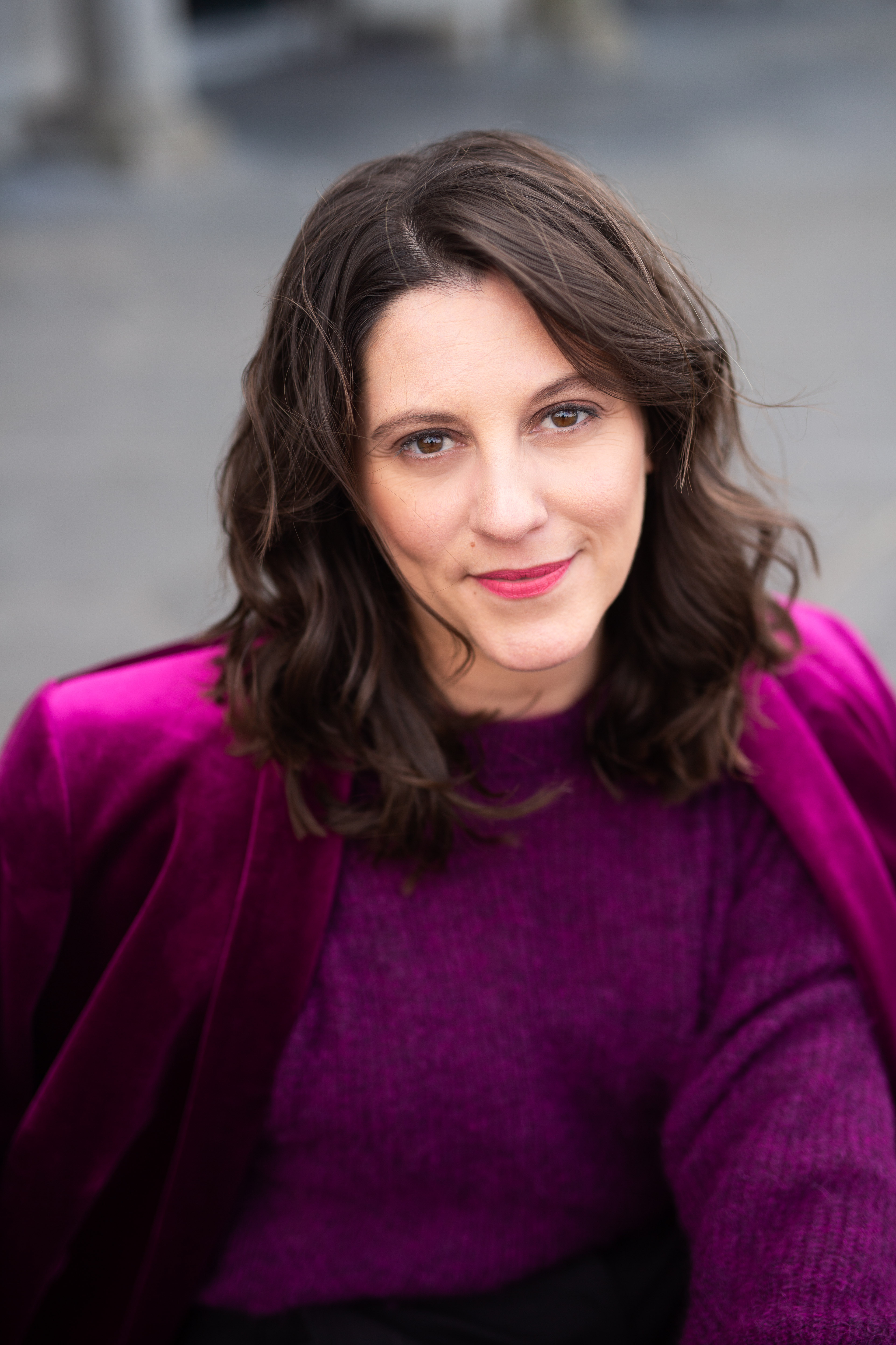 Carly Clark Zimmer wearing a berry-colored jacket