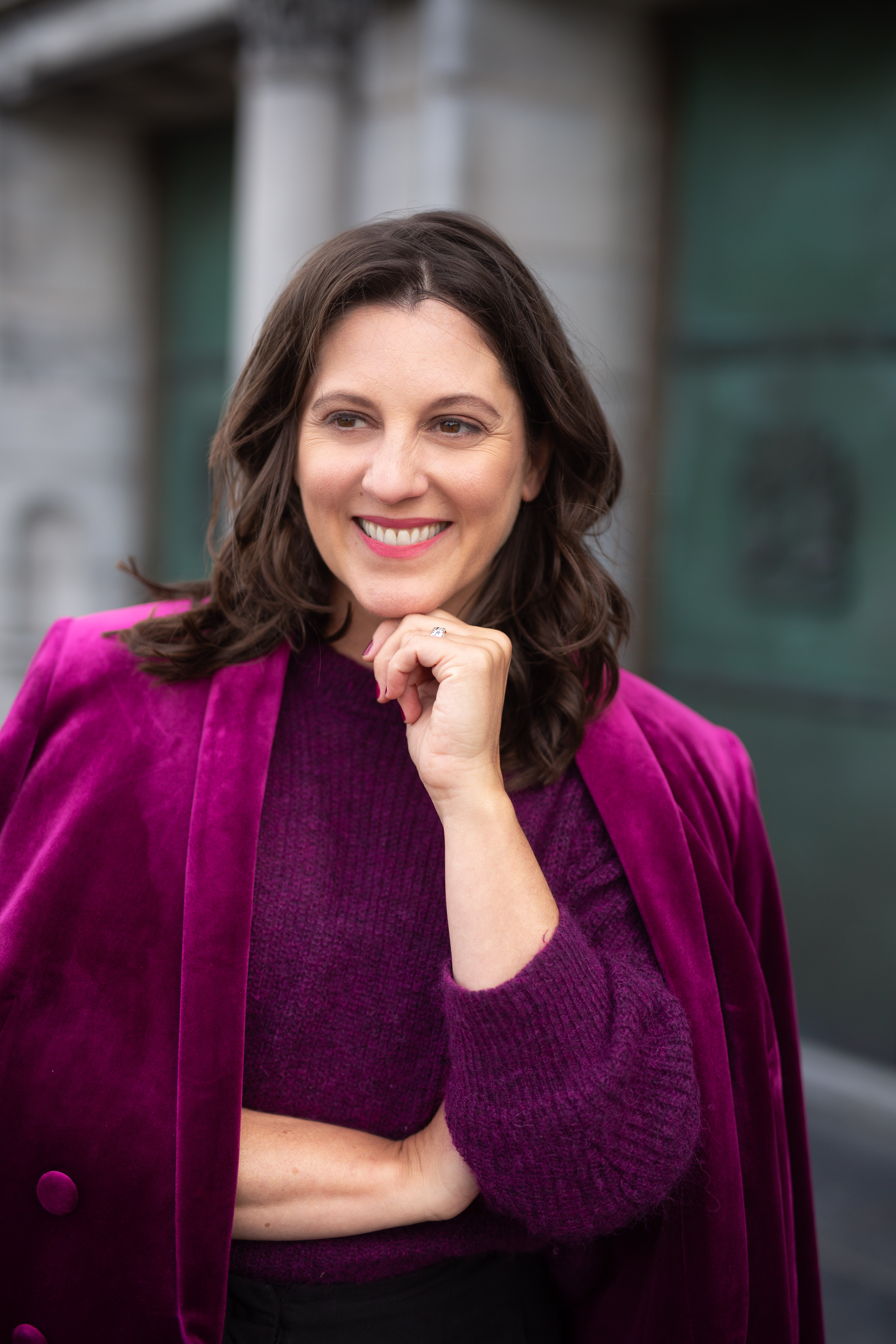 Carly Clark Zimmer wearing a berry jacket
