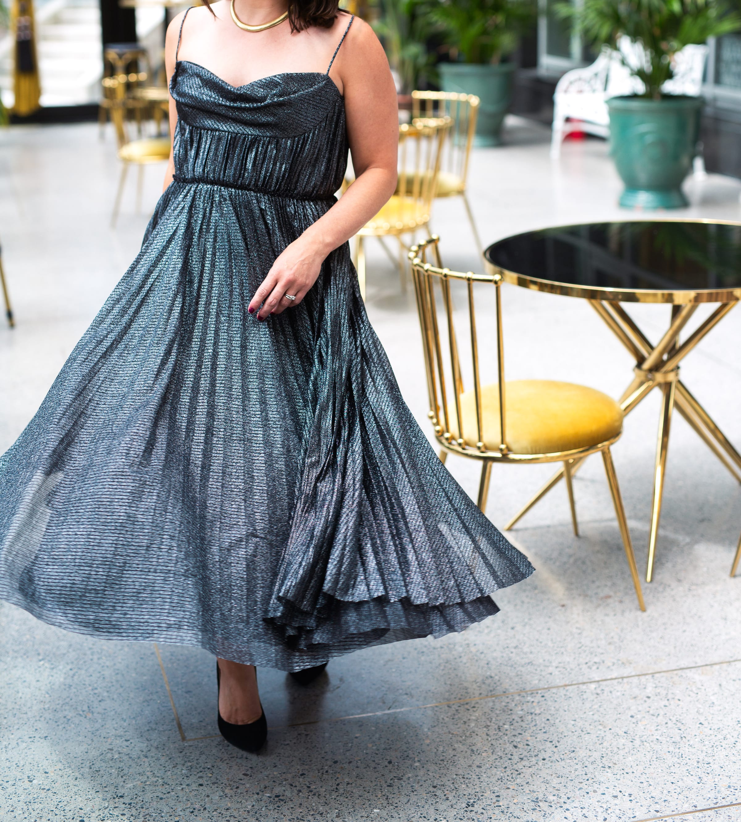 Carly Clark Zimmer in a flowing metallic dress